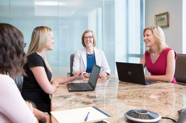 Image of a Juna team members, enthusiastically recalling the milestones and achievements of Juna's successful five-year journey in business.