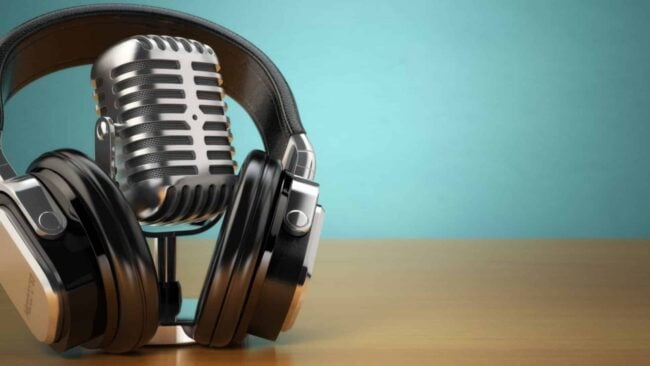 Image of a modern podcast setup with high-quality microphone, headphones, and mixing console, symbolizing the industry-leading insights and expertise shared on Juna's top accounting podcasts.