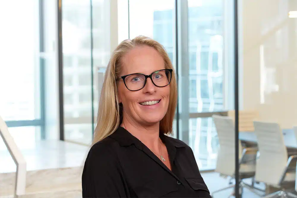 A professional portrait of Missy Katzenmaier, an Accounting Associate at Juna Financial Solutions, looking directly into the camera with a friendly and confident expression.